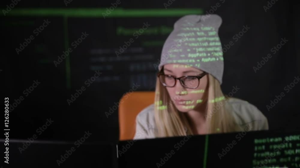 Female hacker working at the computer in dark at night. HD. Female hacker working at the computer in dark at night. HD.