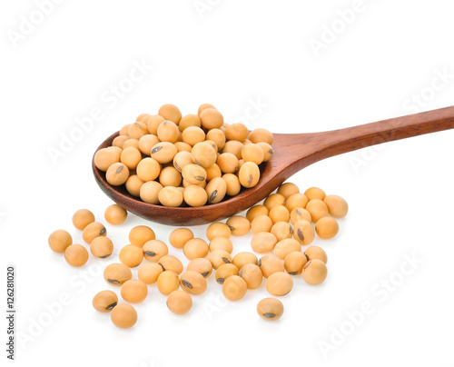 soy beans in wooden spoon on white background