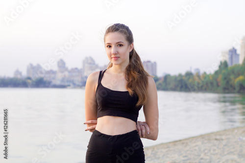 Young woman rests during sport training exercises outdoor in morning