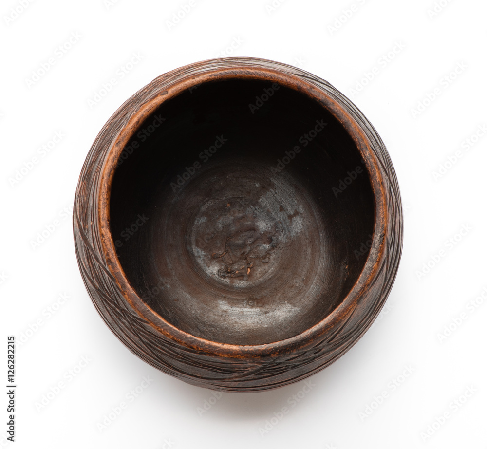 Clay ceramic bowl isolated on white background. Top view. Handmade. Clay ceramic bowl isolated on white background. Top view. Handmade.