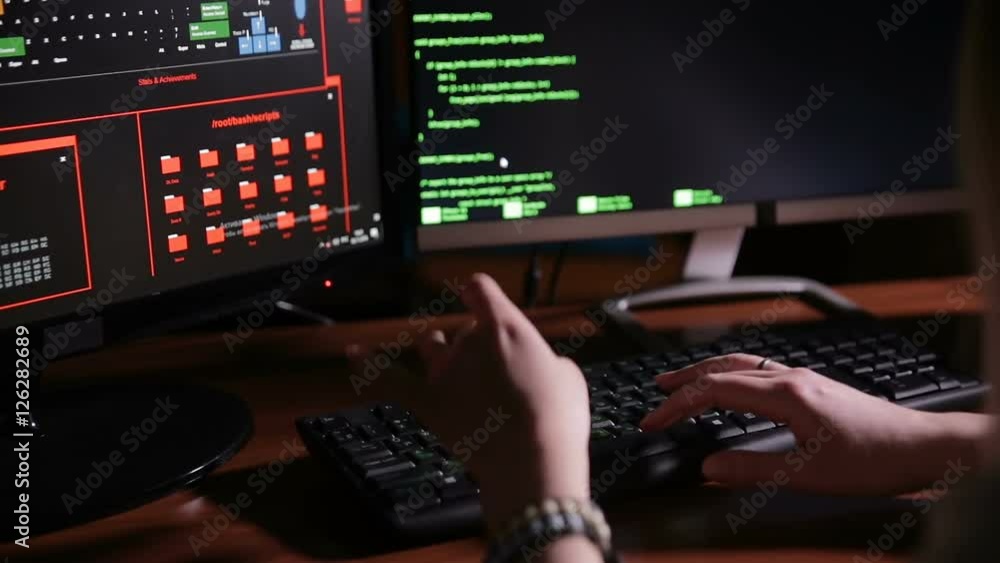 Female hands typing computer code, hacking computer at a dark room. Hacker, programmer at work. HD. Female hands typing computer code, hacking computer at a dark room. Hacker, programmer at work. HD.