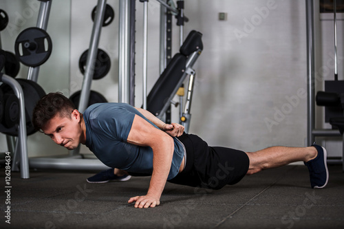 sports guy push-ups in the gym