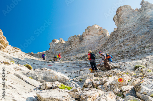 Fotografie OLYMPUS NATIONAL PARK, GREECE - JULY 11, 2015: Tourists climbing the Olympus mountain in Greece