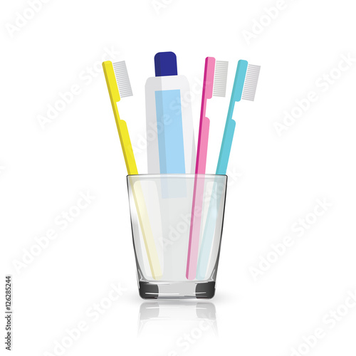 Toothbrush, toothpaste in a glass isolated on white background