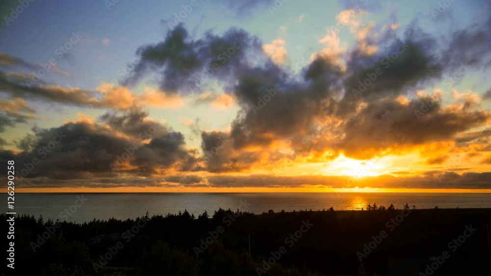 An incredible timelapse sunset with moving storm clouds over the ocean in Cape Breton Nova Scotia Canada An incredible timelapse sunset with moving storm clouds over the ocean in Cape Breton Nova Scotia Canada