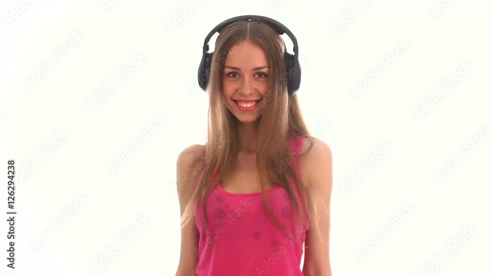 Beauty woman in headphones flirting and smiling Beauty woman in headphones flirting and smiling