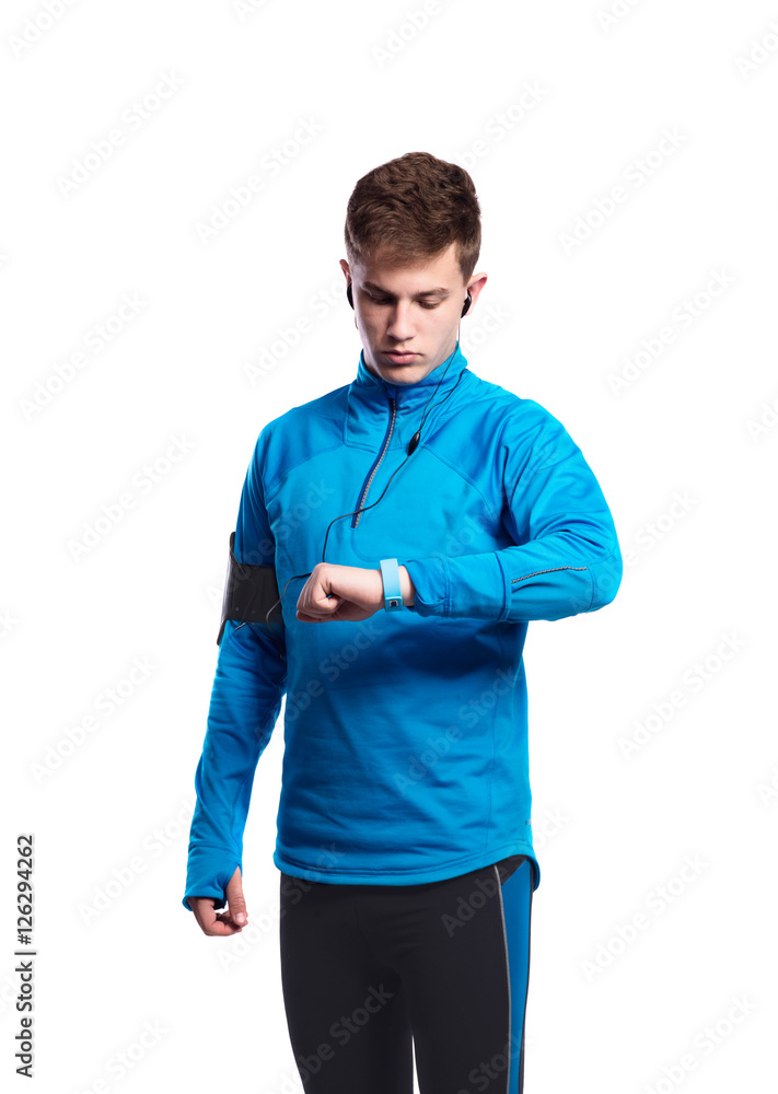 Teenage boy in blue sports sweatshirt. Studio shot, isolated. Teenage boy in blue sports sweatshirt. Studio shot, isolated.