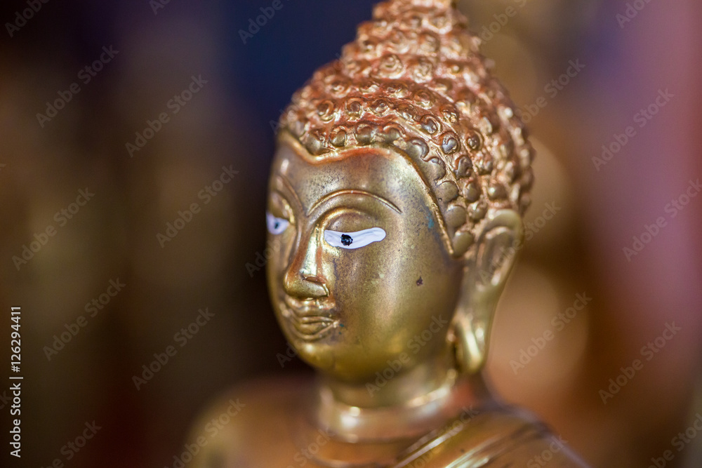 The Buddha statue to gild. Which people use to worship the buddha image. Selective focus.