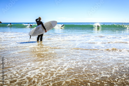 Surfers on Beliche Beach, Sagres, Algarve, Portugal photo