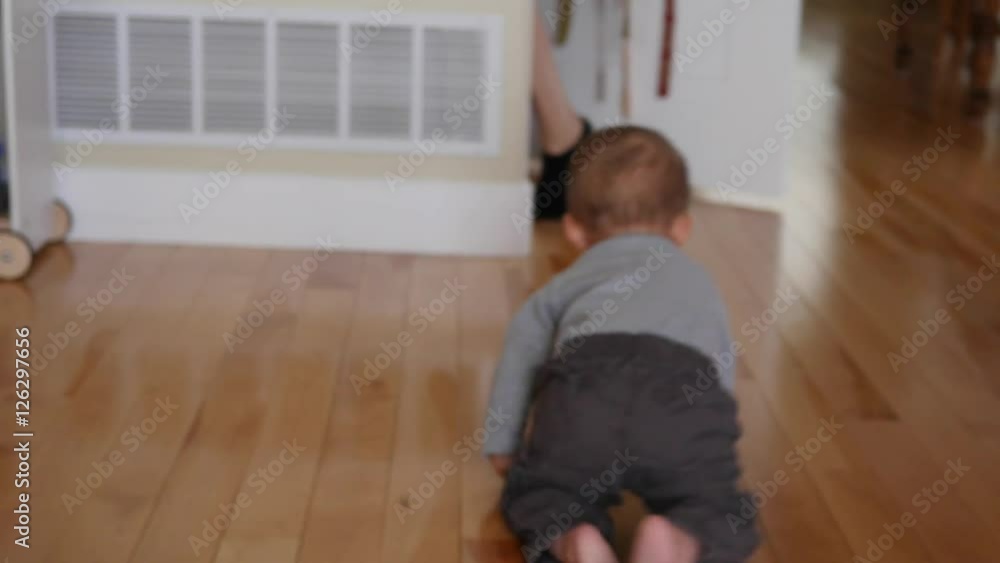 Cute little boy looking for easter eggs in home Cute little boy looking for easter eggs in home