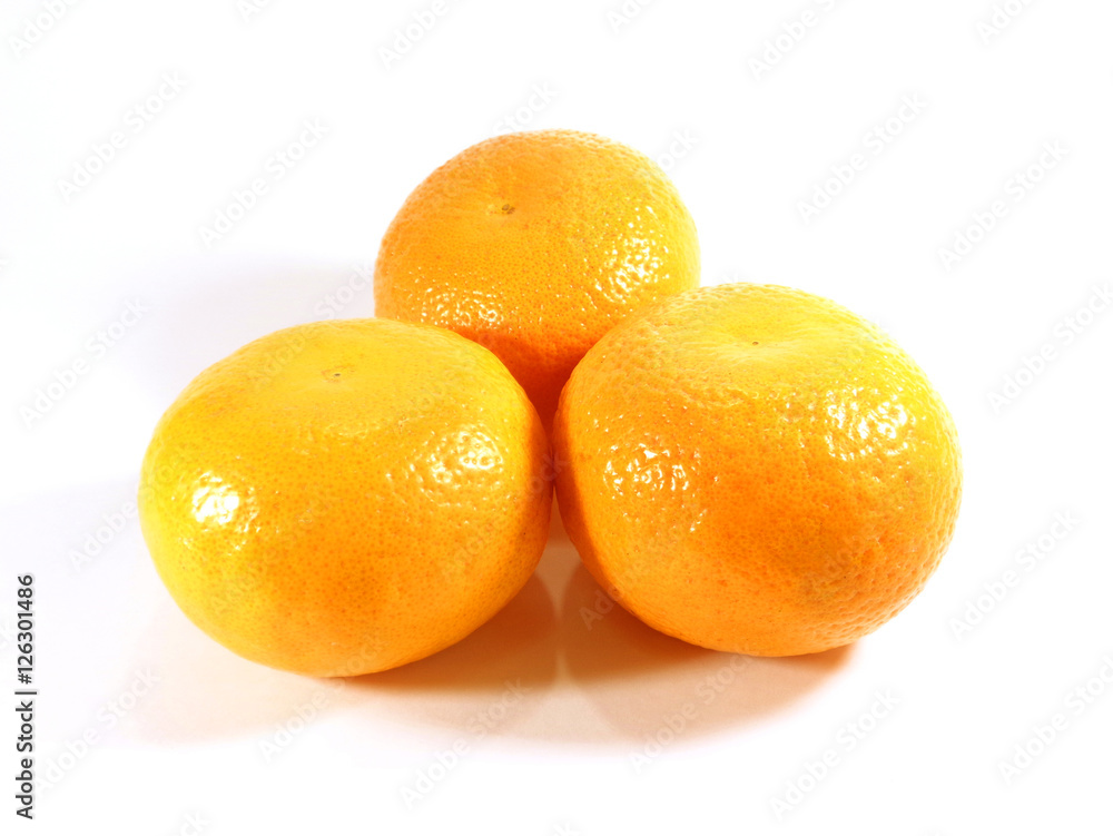 Close-up of three ripe oranges isolated on white background Close-up of three ripe oranges isolated on white background
