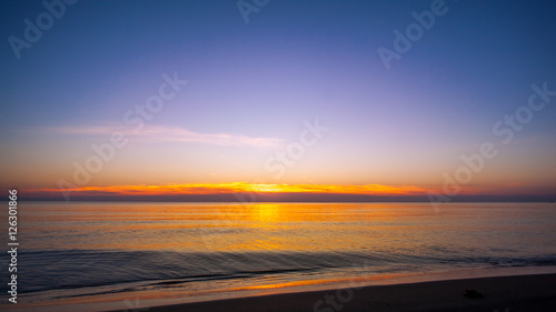 Sunset on the beach with blue sky