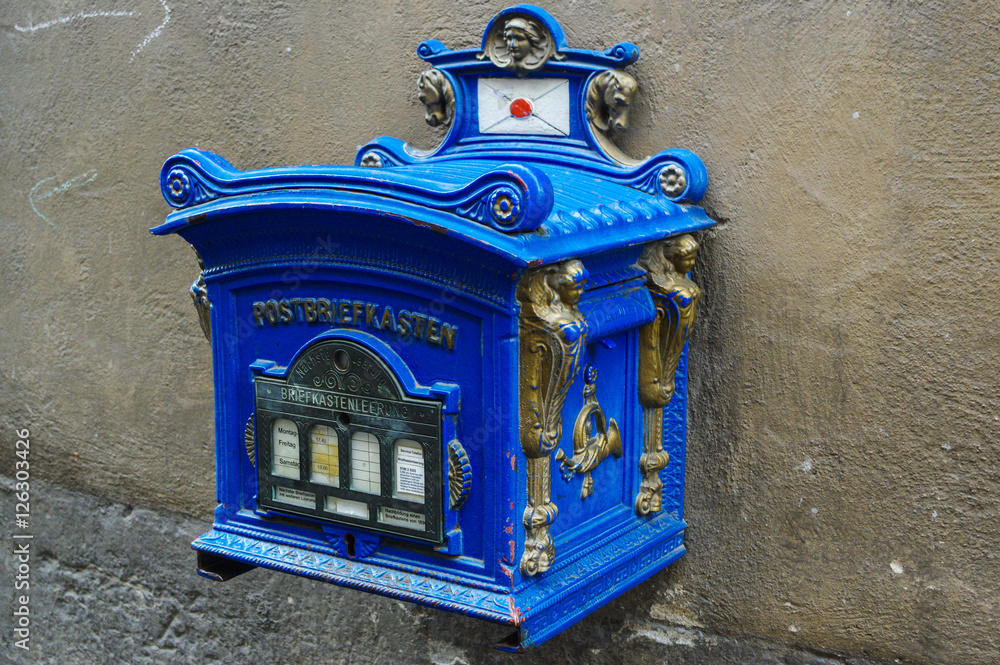 Blue old vintage postbox Germany, public mailbox still in use