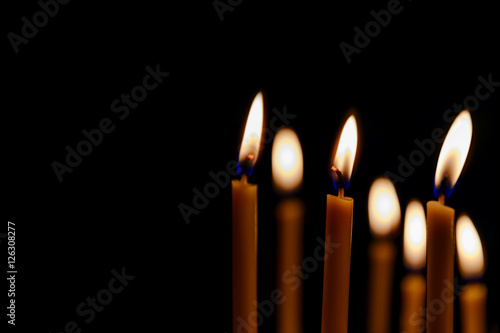 bright candles in dark