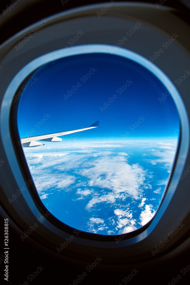 View from airplane window on the sea and clouds View from airplane window on the sea and clouds