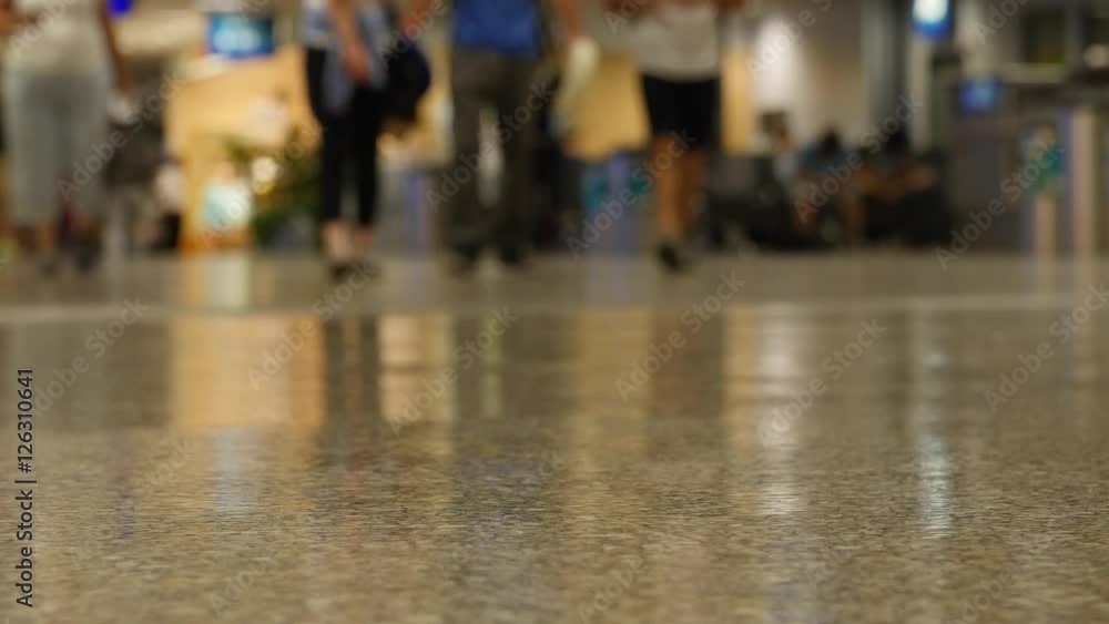 Crowds walking through the airport at night Crowds walking through the airport at night
