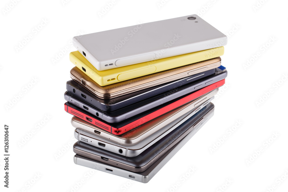 Pile of mobile phone. Heap of the different smartphones isolated Pile of mobile phone. Heap of the different smartphones isolated