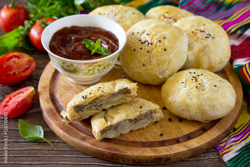 Pies fried samosa on a wooden table, the national dish of Caucas