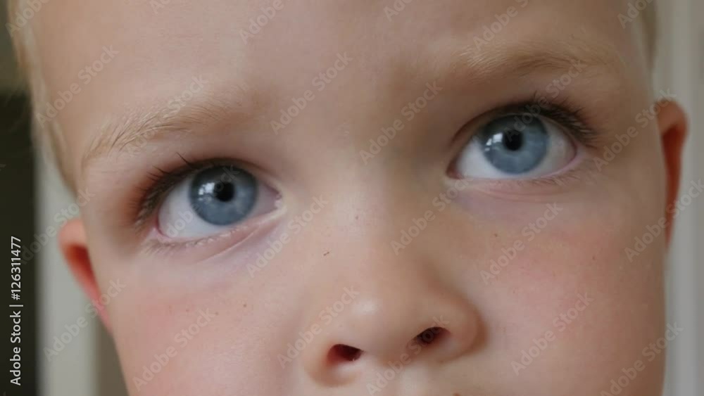 Boy with amazing eyes stares into a camera Boy with amazing eyes stares into a camera
