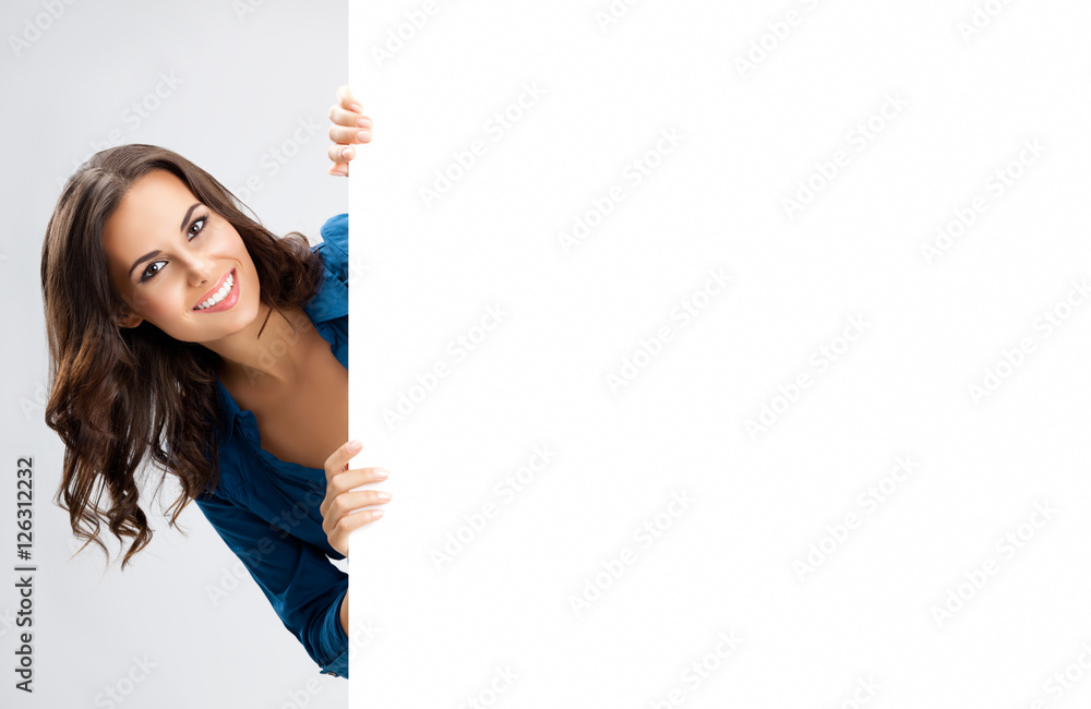 Beautiful young woman showing blank signboard Beautiful young woman showing blank signboard