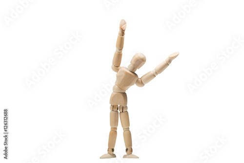 Wooden man practices yoga