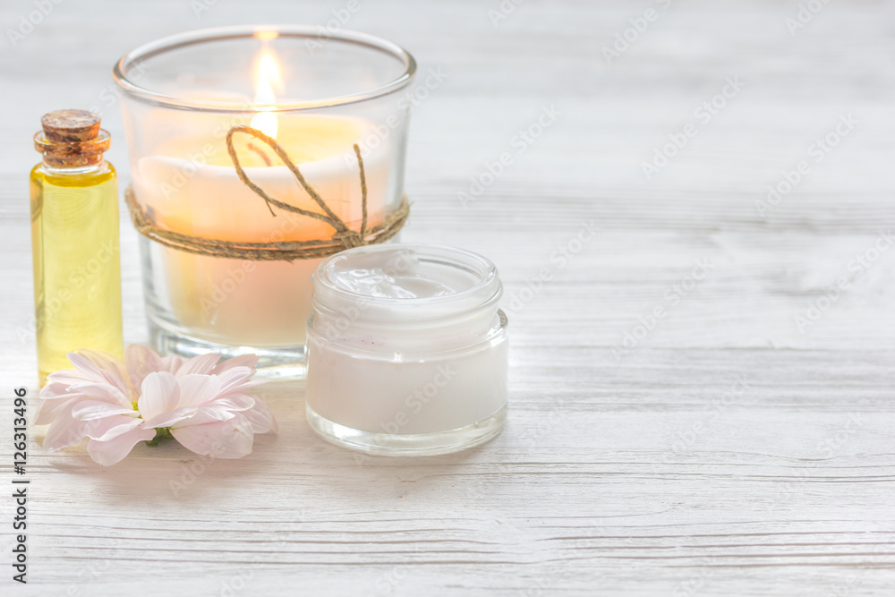 spa nail care with aroma candle on wooden background
