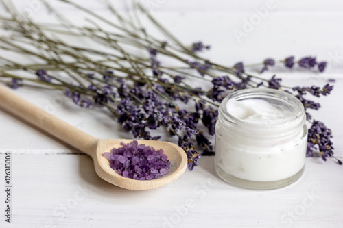 organic cosmetics with lavender on wooden background