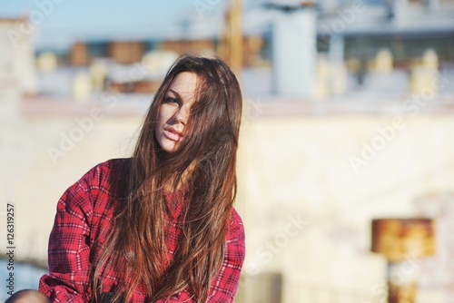 A wonderful portrait of a beautiful young girl with long gorgeous hair, close-up.