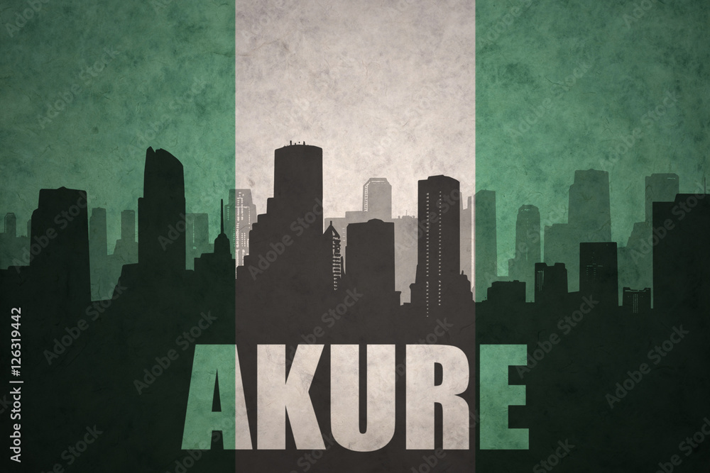 abstract silhouette of the city with text Akure at the vintage nigerian flag