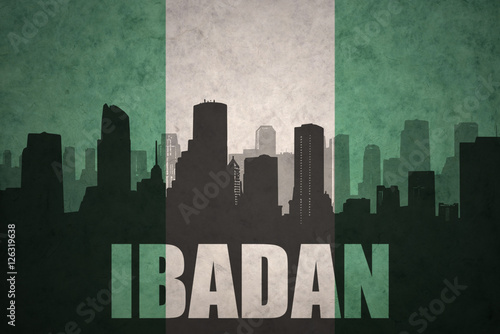 abstract silhouette of the city with text Ibadan at the vintage nigerian flag