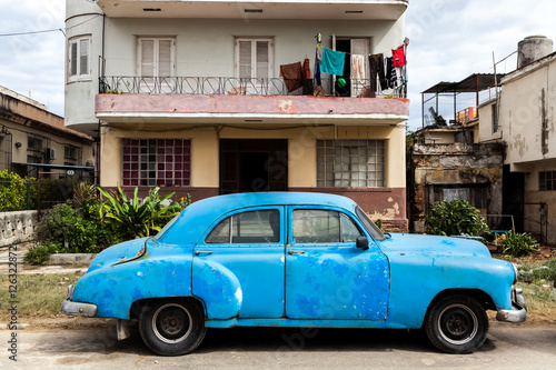 Vintage classic american car parked in a street of Old Havana © genadijs