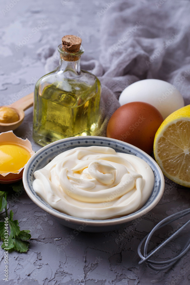 Homemade mayonnaise sauce and olive oil, eggs, mustard, lemon