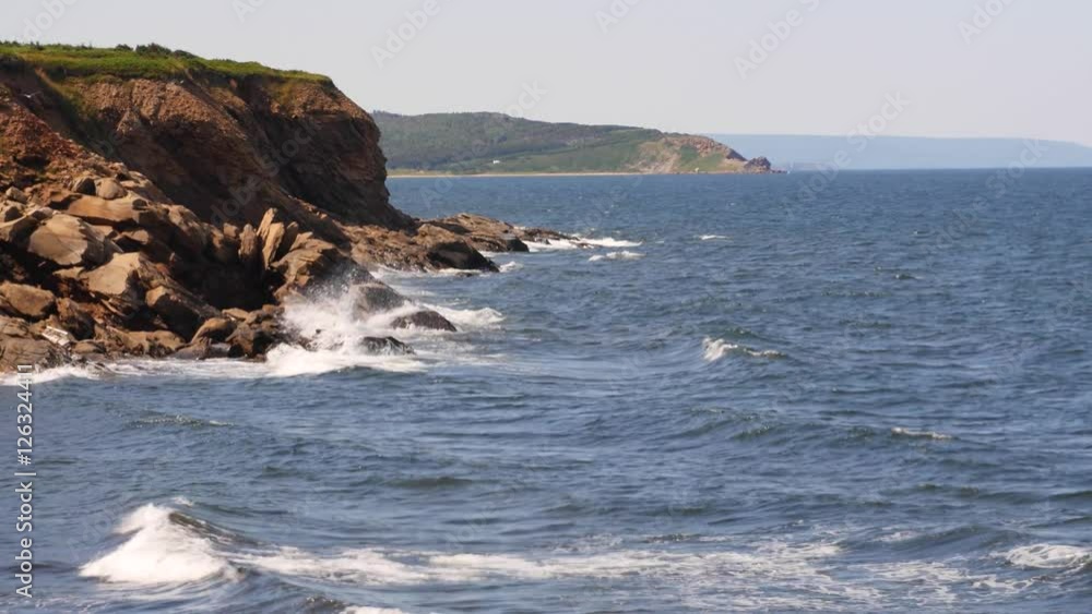 Rough waves crashing on rocky shore from above Rough waves crashing on rocky shore from above