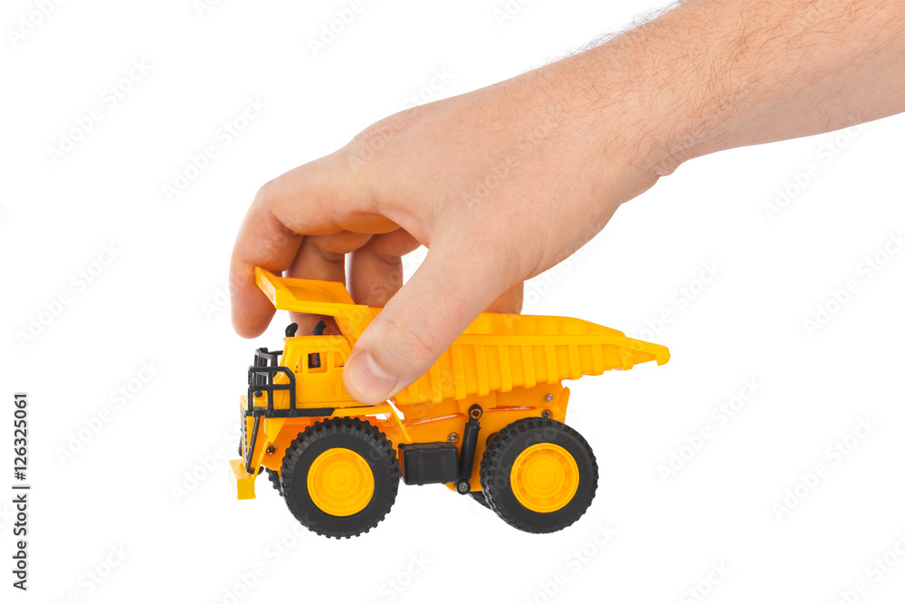 Fototapeta premium Toy car truck in hand