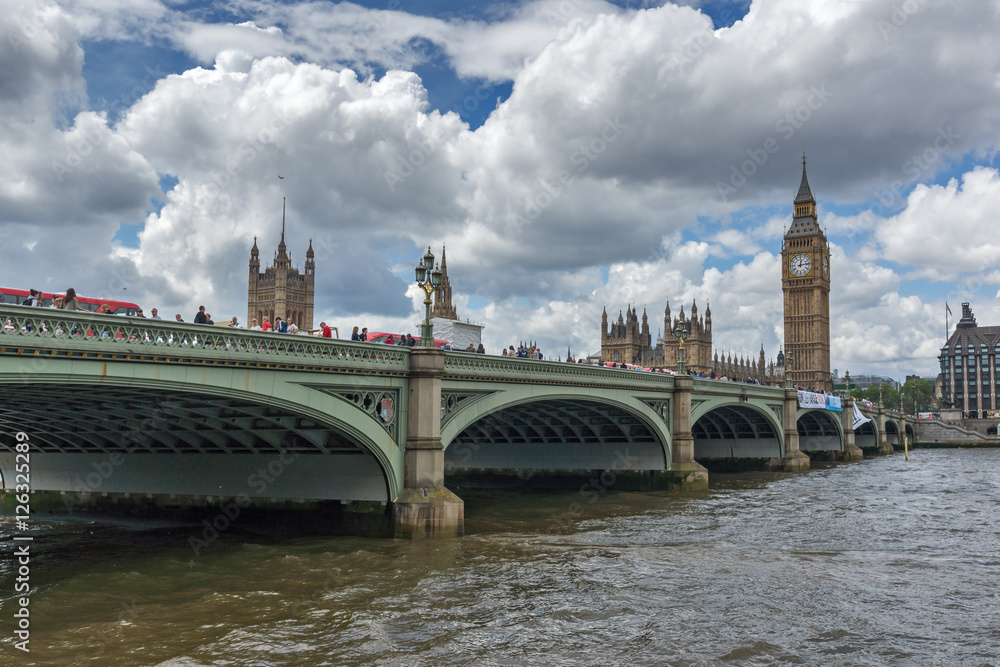 Naklejka premium LONDON, ENGLAND - JUNE 15 2016: Clouds over Westminster Bridge and Big Ben, London, England, United Kingdom