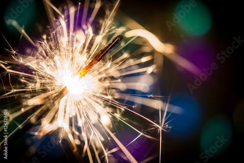 Christmas sparklers and background with colorful bokeh