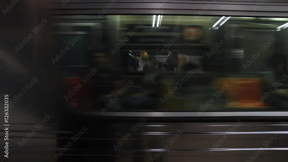 Subway train in New York City flashing by in front of camera Subway train in New York City flashing by in front of camera