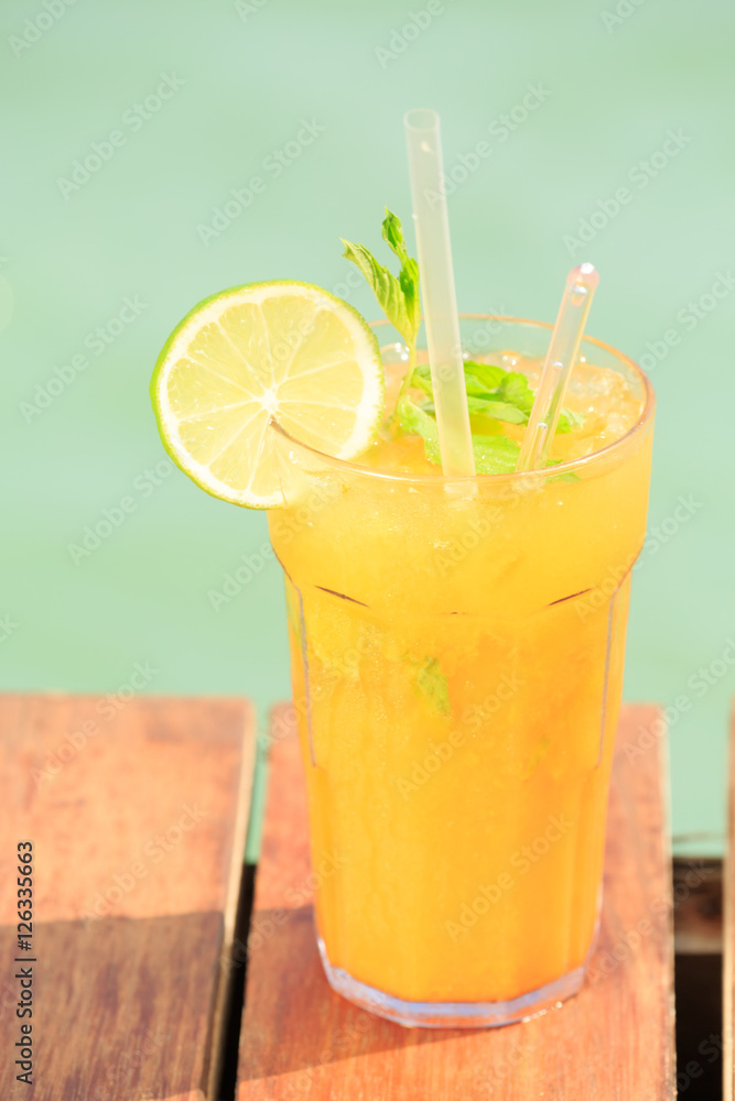 Fototapeta premium Mango mojito on the wooden pier. Concept of luxury tropical vaca