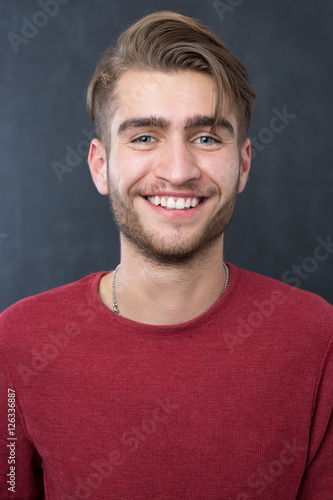 sexy fashion man or student dressed casual smiling against chalk © Myvisuals