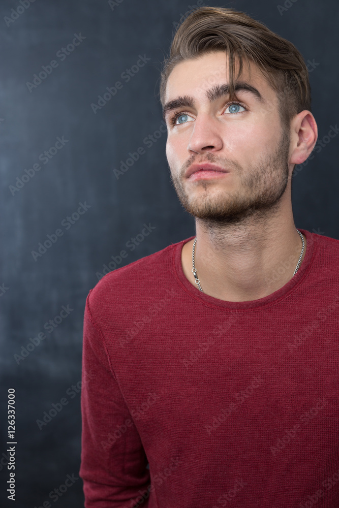 portrait of young startup businessman at modern office, chalkboa