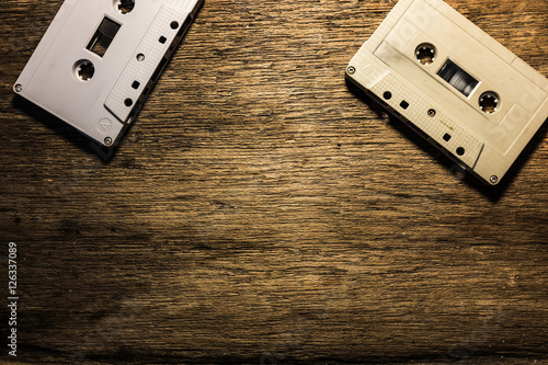 Cassette on wood background. photo