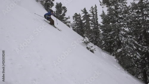 Skiing  in the Mountains to make Deep Powder Turn in Winter Snow (Slow Motion)