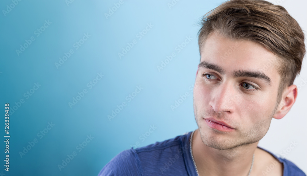 Obraz premium Portrait of an handsome young man with interesting background a