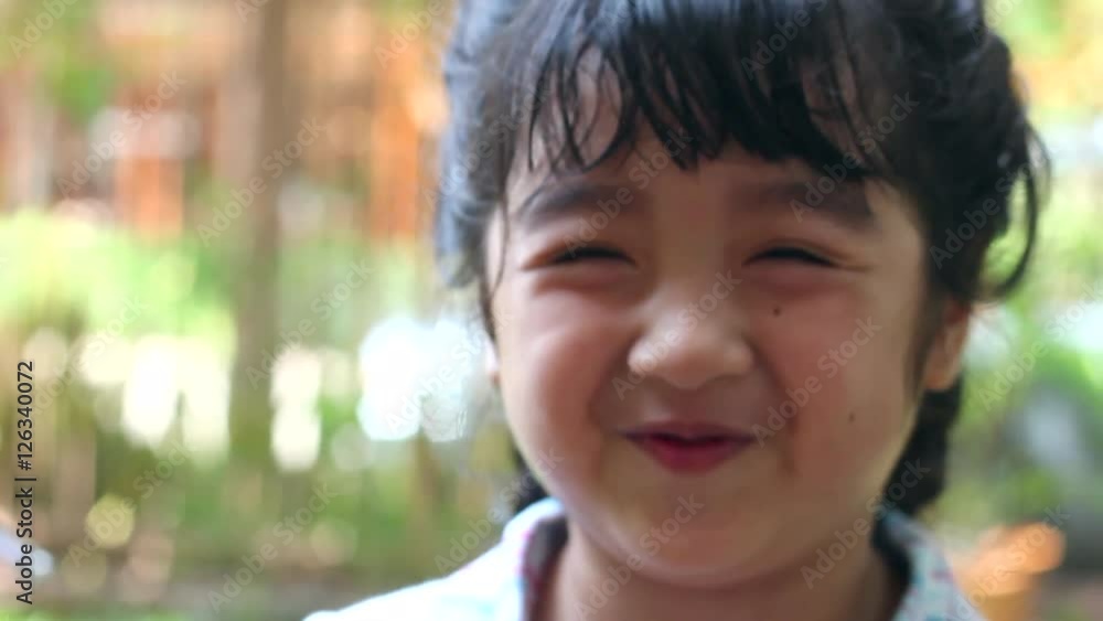 Pretty little girl looking at camera and smiling Pretty little girl looking at camera and smiling
