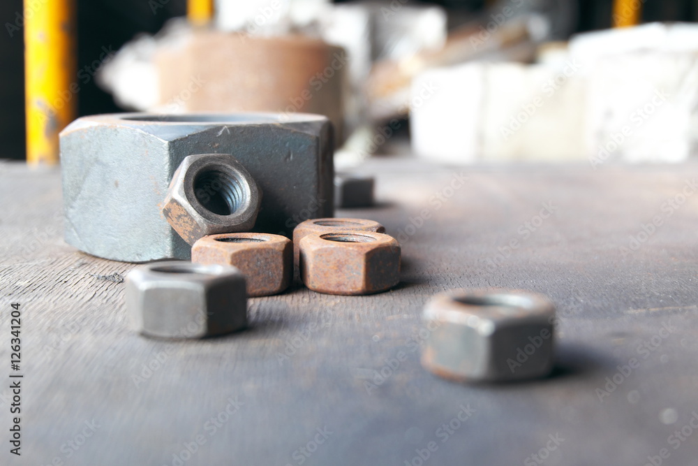 Industrial bolts and nuts with shallow focus.It is available as long as the rust.copy space. Industrial bolts and nuts with shallow focus.It is available as long as the rust.copy space.