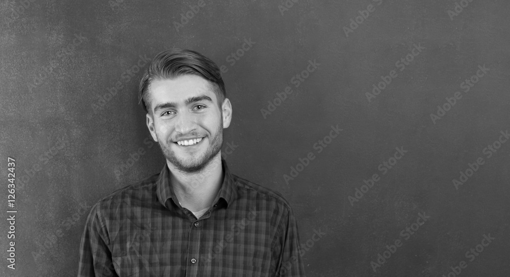 Fototapeta premium portrait of young startup businessman at modern office, chalkboa