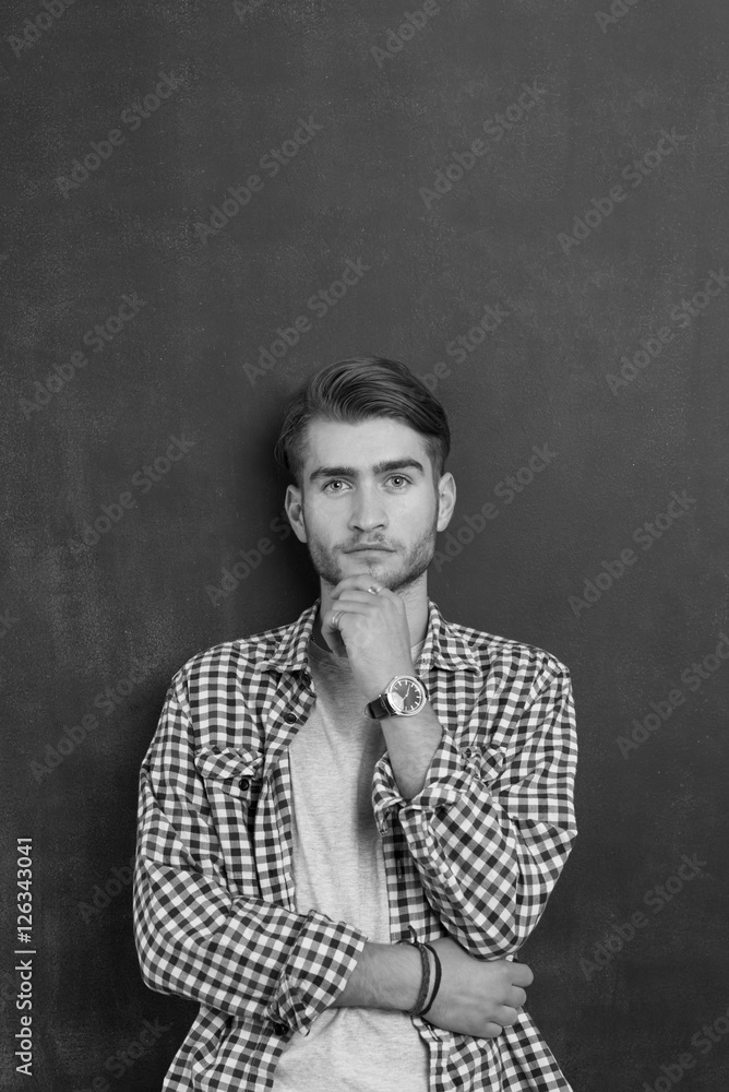 Portrait of a cheerful young man in checkered shirt Portrait of a cheerful young man in checkered shirt