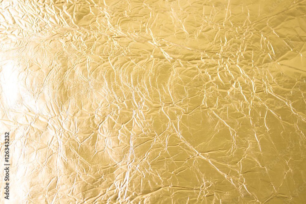 Fototapeta premium Gold wrinkled paper texture abstract background
