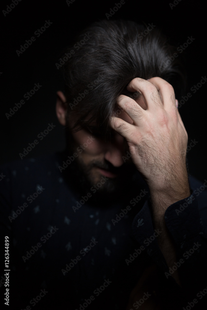 low key portrait of young handsome man in dark shirt isolated o low key portrait of young handsome man in dark shirt isolated o