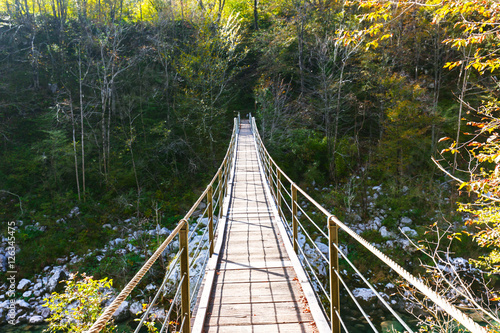 Old wooden bridge over Soca river